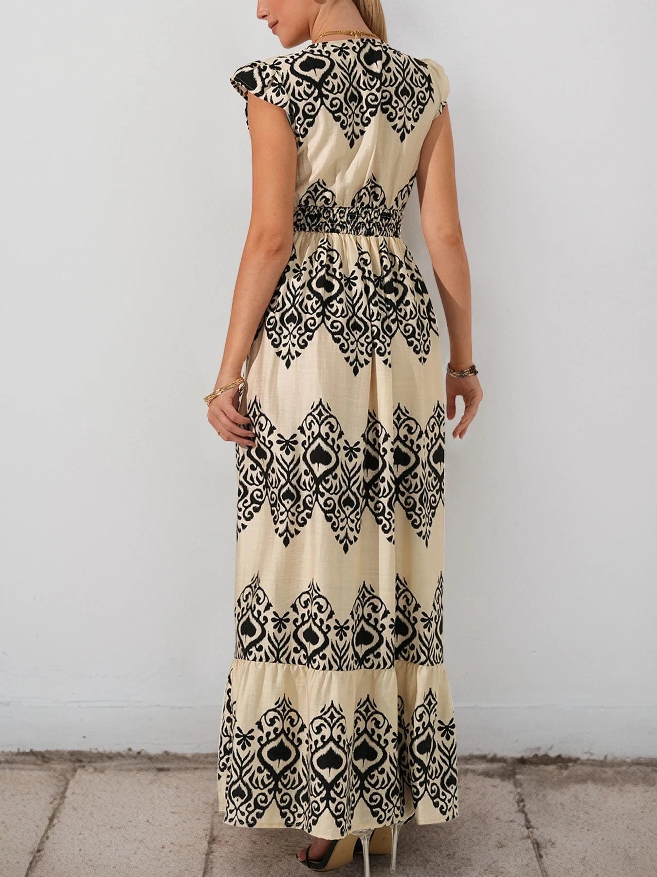 Beige bohemisk maxiklänning med svart mönster
