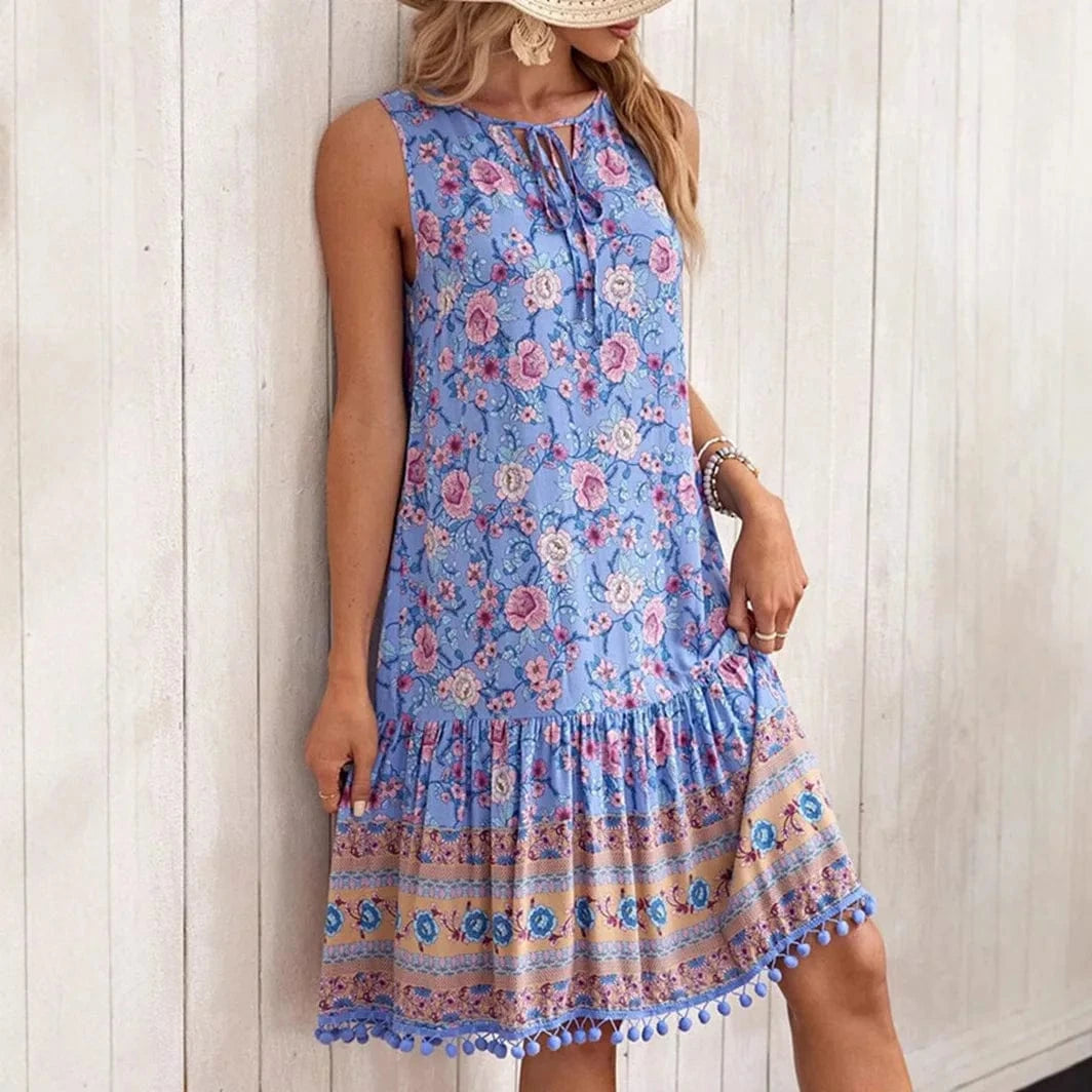 Blå klänning med rosa blommor