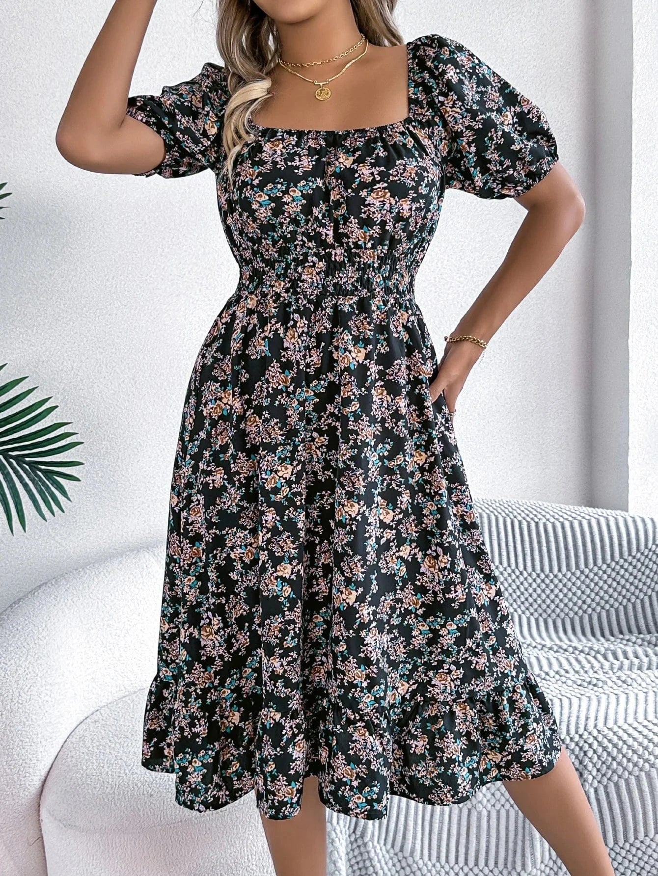 Blommig off-shoulder midiklänning
