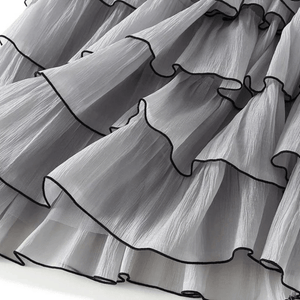 Kjol i våder med svarta kantband