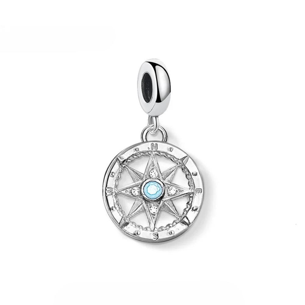 Kompass berlock i silver med turkos