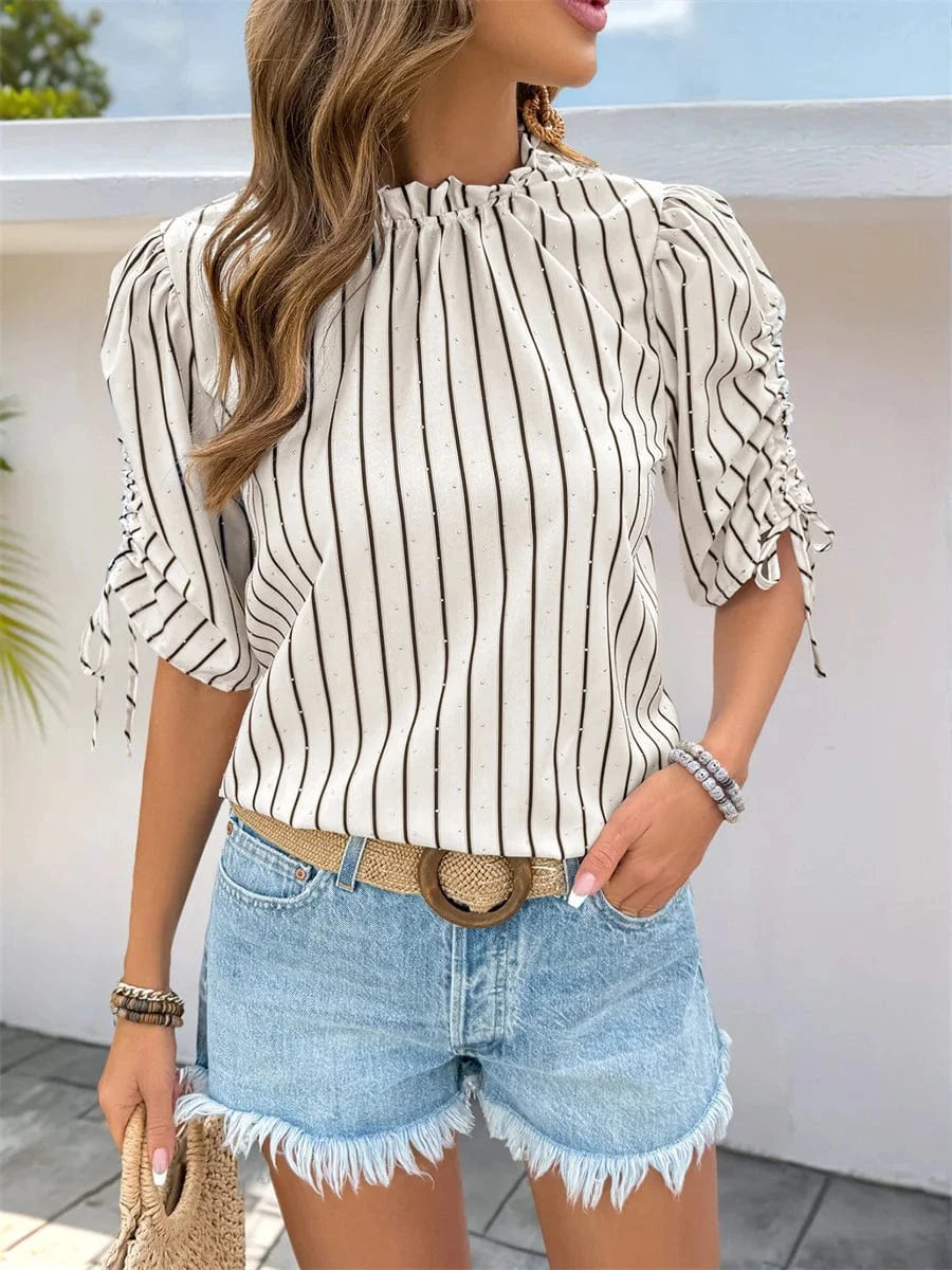 Randig blus med volang