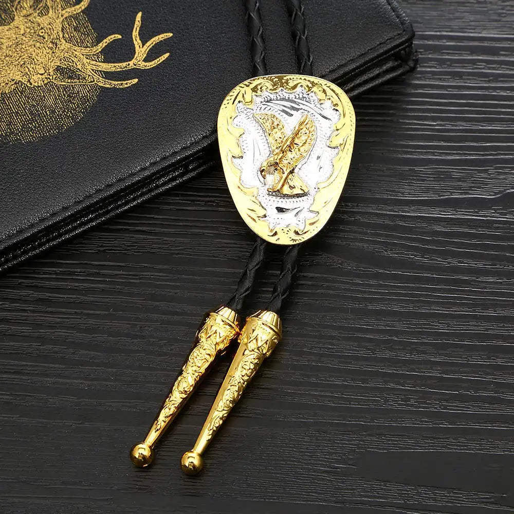Bolo tie i guld med örnmotiv
