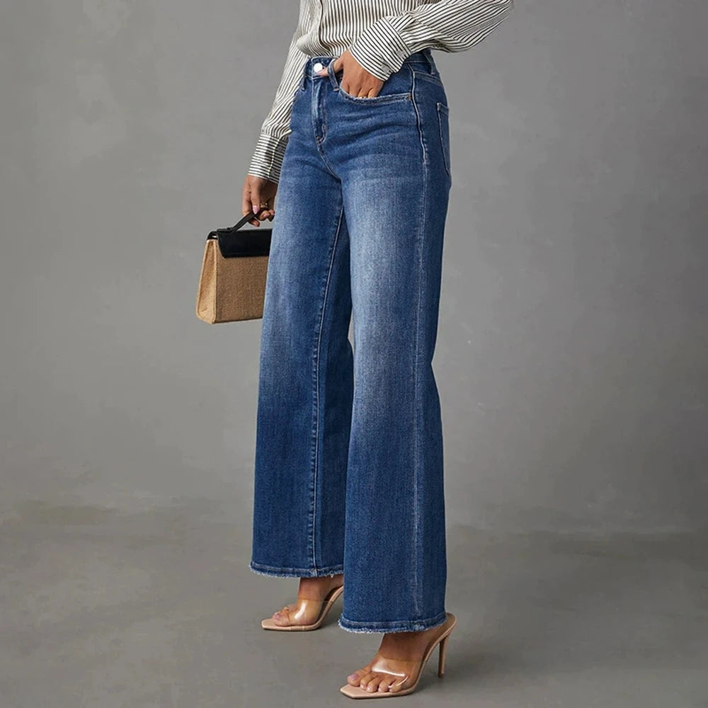Högmidjade mörkblå vida jeans för dam