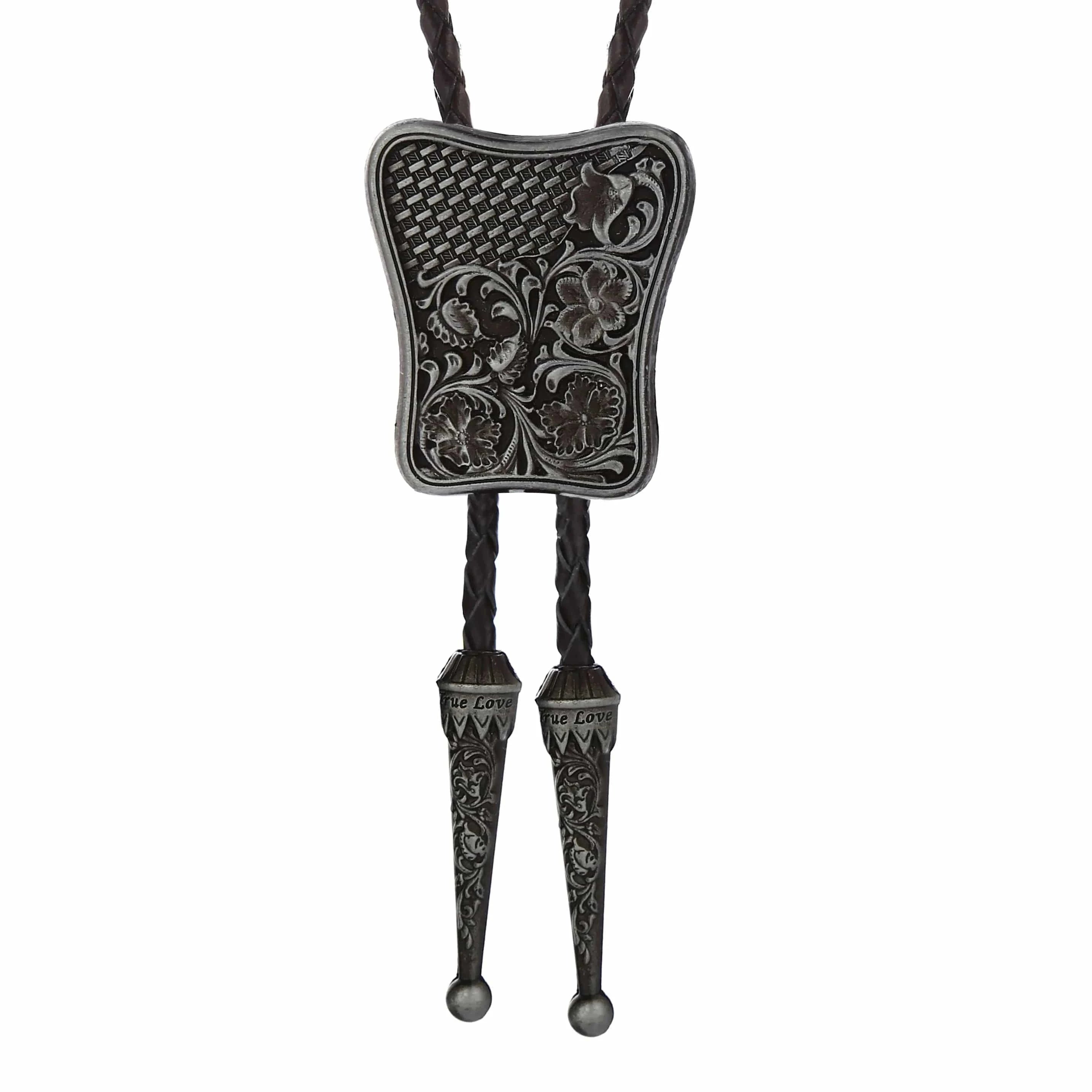 Bolo tie i rektangulär mörk metall med blommigt vintagemönster