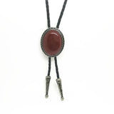 Bolo tie med glasdetalj och ovalt vintagehänge
