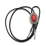 Bolo tie med oval sten och flätat läderband