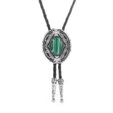 Bolo tie med oval sten och vågformad ram