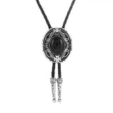 Bolo tie med oval sten och vågformad ram