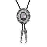 Bolo tie rund med blå rhinestone och flätad läderrem