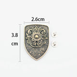 Concho sköldformad med blomgravyr