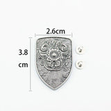 Concho sköldformad med blomgravyr