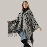Öppen poncho med blommigt jacquardmönster