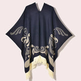 Poncho med fransar